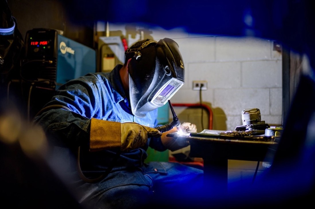 Welder TIG welding a small part